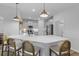 Kitchen island with barstool seating, quartz countertops, and stainless appliances at 101 Guernsey Ln, Summerville, SC 29483