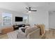 Cozy living room with natural light, a comfortable couch, a ceiling fan, and views of the yard at 101 Guernsey Ln, Summerville, SC 29483
