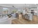 Open-concept living room with a modern kitchen, stylish furnishings, and lots of natural light at 101 Guernsey Ln, Summerville, SC 29483