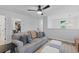 Upstairs living room boasts neutral colors, a ceiling fan, comfortable seating, and access to a closet at 101 Guernsey Ln, Summerville, SC 29483