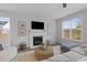 Cozy living room features a fireplace, neutral color palette, and comfortable seating at 101 Guernsey Ln, Summerville, SC 29483