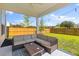 Covered patio with comfortable seating and a coffee table is the perfect spot to relax and unwind at 101 Guernsey Ln, Summerville, SC 29483