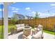 Relaxing patio with outdoor seating, fire pit, and string lights offers a cozy space for enjoying the outdoors at 101 Guernsey Ln, Summerville, SC 29483
