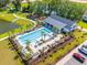 Aerial view of community pool, clubhouse, playground, and surrounding green spaces is perfect for the whole Gathering at 101 Guernsey Ln, Summerville, SC 29483