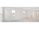 Neutral bedroom offers natural light with two windows, and light carpet flooring at 1029 Riverbed Retreat Ln, Summerville, SC 29485