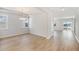 Bright dining room featuring beautiful wood floors, modern chandelier and lots of natural light at 1029 Riverbed Retreat Ln, Summerville, SC 29485