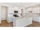 Modern kitchen featuring white cabinetry, stainless steel appliances, and a large center island at 1029 Riverbed Retreat Ln, Summerville, SC 29485