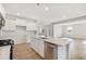 Spacious kitchen featuring stainless steel appliances, white cabinets, and a large center island at 1029 Riverbed Retreat Ln, Summerville, SC 29485