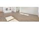 Open concept living room showcasing hardwood floors and natural light from the kitchen at 1029 Riverbed Retreat Ln, Summerville, SC 29485