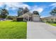 This home features a well-manicured lawn, a long driveway, and a charming exterior, making it an inviting property at 1034 Steelechase Ln, Hanahan, SC 29410
