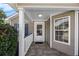 Covered front porch featuring tile flooring and white railings offering curb appeal and charm at 1034 Steelechase Ln, Hanahan, SC 29410