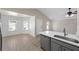Open kitchen featuring an island, stainless steel appliances, gray cabinets and a breakfast nook at 1034 Steelechase Ln, Hanahan, SC 29410