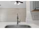 Close up of stainless steel kitchen sink with a modern faucet against the white tile backsplash at 1034 Steelechase Ln, Hanahan, SC 29410