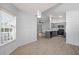Open concept dining and kitchen area features wood-look floors, shaker cabinets and stainless steel appliances at 1034 Steelechase Ln, Hanahan, SC 29410