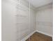 Walk-in closet with ample storage space featuring white wire shelving and wood-look floors at 1034 Steelechase Ln, Hanahan, SC 29410