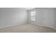 Bright bedroom with carpeted floors and natural light from the window at 1035 Forrest Creek Dr, Summerville, SC 29483