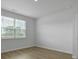 Bright bedroom with neutral walls, window, and a sleek modern design at 1035 Forrest Creek Dr, Summerville, SC 29483