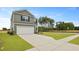 Inviting two-story home with a two-car garage and green lawn set against a clear blue sky at 1035 Forrest Creek Dr, Summerville, SC 29483