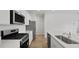 Stylish kitchen featuring stainless appliances, white countertops and cabinets, and wood-look flooring at 1035 Forrest Creek Dr, Summerville, SC 29483