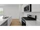 Well-lit kitchen with stainless appliances, modern cabinets, and an island with a sink at 1035 Forrest Creek Dr, Summerville, SC 29483