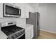 Elegant kitchen with stainless steel appliances, white cabinets, sleek countertops, and modern fixtures at 1035 Forrest Creek Dr, Summerville, SC 29483