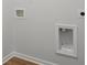 New laundry hook ups installed with white trim at 1035 Forrest Creek Dr, Summerville, SC 29483
