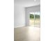 Bright, empty living room with sliding glass door showing backyard space at 1035 Forrest Creek Dr, Summerville, SC 29483