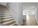 Bright staircase leads to an open-concept living area with hardwood floors at 1035 Forrest Creek Dr, Summerville, SC 29483