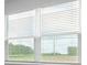 Window with white blinds and view of wooded area at 1035 Forrest Creek Dr, Summerville, SC 29483