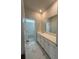 Bathroom featuring double vanity sinks, marble-patterned tile flooring, and access to shower and toilet at 1051 Scotch Bonnet Way, Summerville, SC 29485