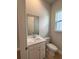 Powder room features a white vanity, modern sink, and a neutral color scheme at 1051 Scotch Bonnet Way, Summerville, SC 29485