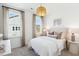 Bright bedroom with two large windows, a pendant light fixture, and neutral decor at 1051 Scotch Bonnet Way, Summerville, SC 29485