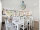 Elegant dining room with a stylish chandelier, seating for six, and open views to the living spaces at 1051 Scotch Bonnet Way, Summerville, SC 29485
