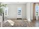 Light-filled entryway with hardwood floors, a decorative rug, and windows with neighborhood views at 1051 Scotch Bonnet Way, Summerville, SC 29485
