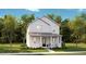 Charming two-story home with a covered front porch and beautifully landscaped yard at 1051 Scotch Bonnet Way, Summerville, SC 29485