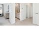 Hallway view of a bathroom with double vanity and an adjacent bedroom for convenient access at 1051 Scotch Bonnet Way, Summerville, SC 29485