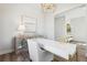 Elegant office space with a white and gold desk, chic decor, and a comfortable seating area at 1051 Scotch Bonnet Way, Summerville, SC 29485