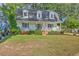 Charming two-story home with a covered front porch and well-manicured landscaping at 106 Cicero Ct, Goose Creek, SC 29445