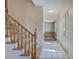 View of the foyer with stairs and white tile flooring at 106 Cicero Ct, Goose Creek, SC 29445