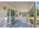 Inviting front porch with rocking chairs and a welcoming pineapple-themed door decoration at 106 Cicero Ct, Goose Creek, SC 29445