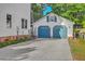 Detached two-car garage with blue doors and an overhead loft space on a sunny day at 106 Cicero Ct, Goose Creek, SC 29445