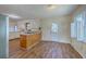 Bright kitchen area featuring laminate flooring and neutral paint at 106 Cicero Ct, Goose Creek, SC 29445