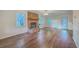 Spacious living room boasts a brick fireplace and wood floors at 106 Cicero Ct, Goose Creek, SC 29445