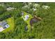 Aerial view of property, pond and lush greenery surrounding neighborhood at 110 Huntington Ct, Walterboro, SC 29488