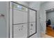 Bathroom features a bathtub with shower and clear sliding glass doors to the shower at 110 Huntington Ct, Walterboro, SC 29488