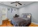 Comfortable bedroom featuring a ceiling fan, hardwood floors, and plenty of natural light at 110 Huntington Ct, Walterboro, SC 29488