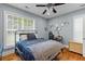 Relaxing bedroom features a cozy bed, ceiling fan, decor, and a window with natural light at 110 Huntington Ct, Walterboro, SC 29488