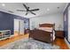 Cozy bedroom featuring a ceiling fan, hardwood floors, and a calming color scheme at 110 Huntington Ct, Walterboro, SC 29488