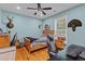 Bedroom features a full-sized bed, ceiling fan, wood floors, and lots of decorative elements at 110 Huntington Ct, Walterboro, SC 29488