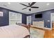 Comfortable bedroom with hardwood floors, dresser, TV and lots of natural light at 110 Huntington Ct, Walterboro, SC 29488